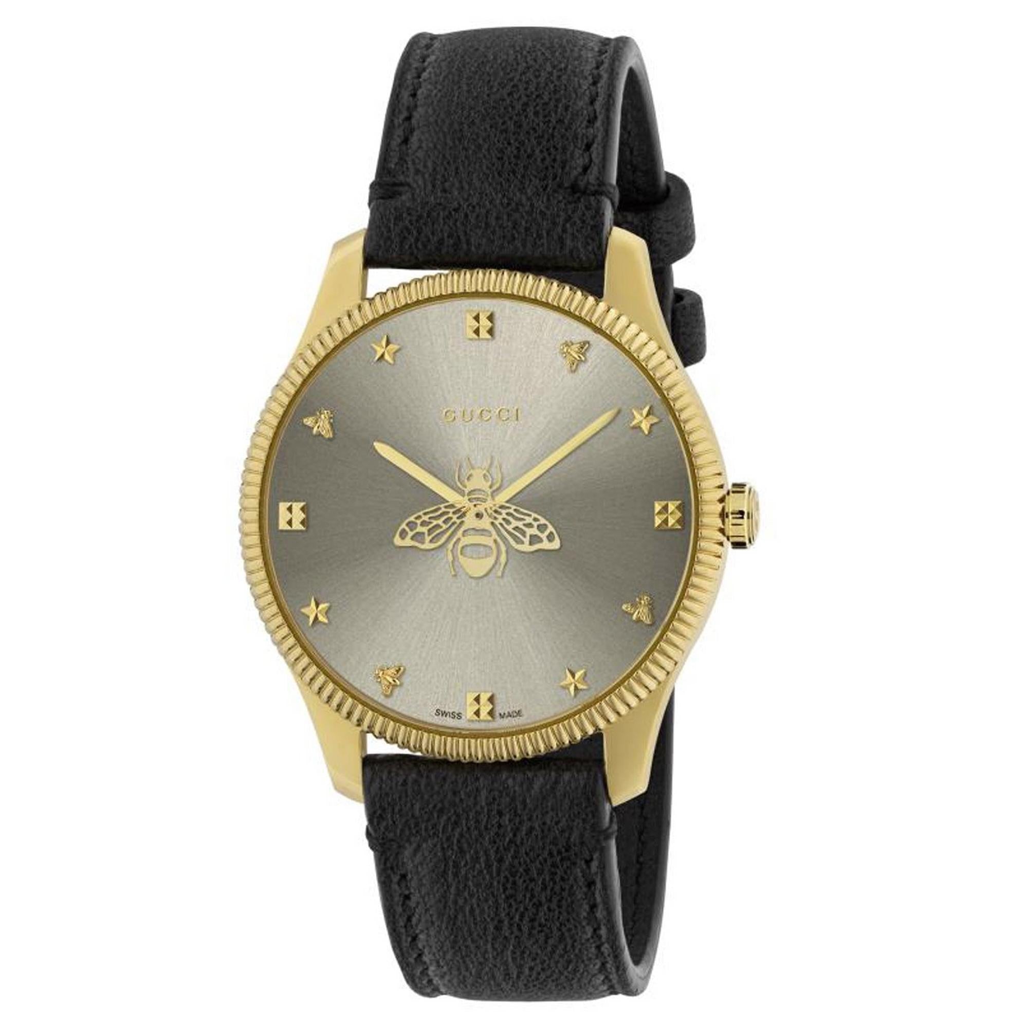 Elegant Gucci G-Timeless Ladies' Gold Tone Black Leather Watch